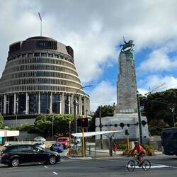 The circular building is the parliament and is known as "The Hive"