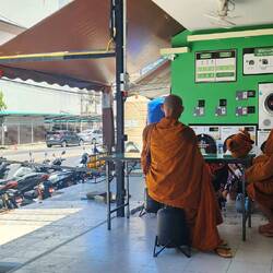 Monks stopped by on the holiday to pray with the laundry mat owners 🙏