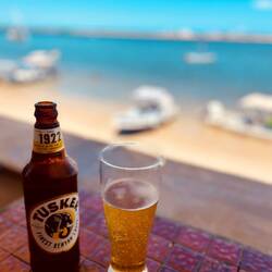 My refreshing beer at the terrace of the Peponi Hotel at Sheila Beach