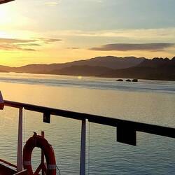 Julie enjoying a cocktail while viewing sunset