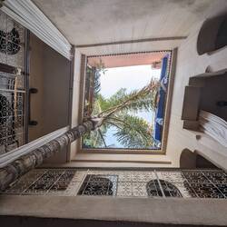 A riad is a place to stay with a central court open to the sky...