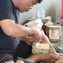 Worker carving beautiful art piece