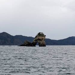Cool little rock arch approaching Wharekaho