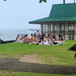 Rain did not stop girls sitting on grass