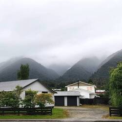 Cloud covered mountains for our arrival into Fox Glacier township