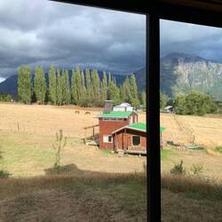 Looking out our room at the hostel with the owners cabin in foreground