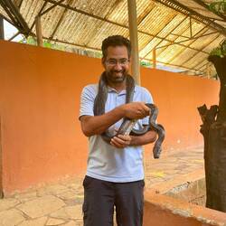 Me holding a python in the Snake House