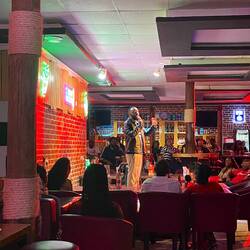 A Comedian on stage at the Standup Comedy Show