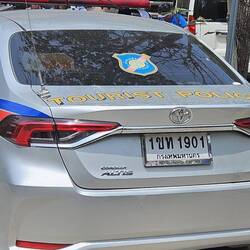 It's hard to see but check out what's written on the trunk of the car