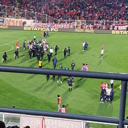 Riot police breaking up the team brawl