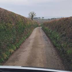 Long lane down to house same width as van