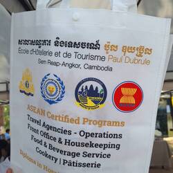 Young student recruiting for the "best tourism school in Asia"