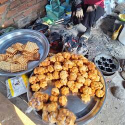 We sample muffins and waffles, cooking over charcoal in 30 degree heat