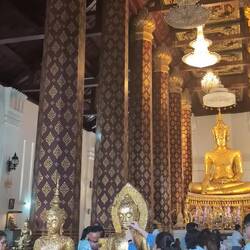 Buddhists place 'gold leaf' on Buddha to pay homage but also to appease spirits and ask for favours