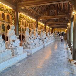 500 Arahat statues line the breezeway, note rub marks from followers