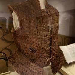 Tunic with bullet hole visible