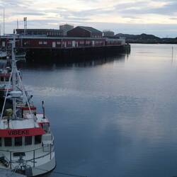 The cabins and harbour at Ballstad.