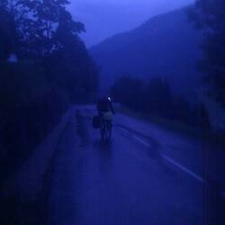 Climbing the col in the rain, the clouds making the evening prematurely dark: less than ideal.