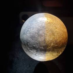 Bottom of an engraved silver dish