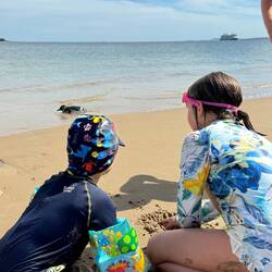 The children were intrigued with the penguin