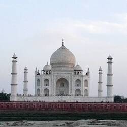 Taj Mahal From Across River At Sunset