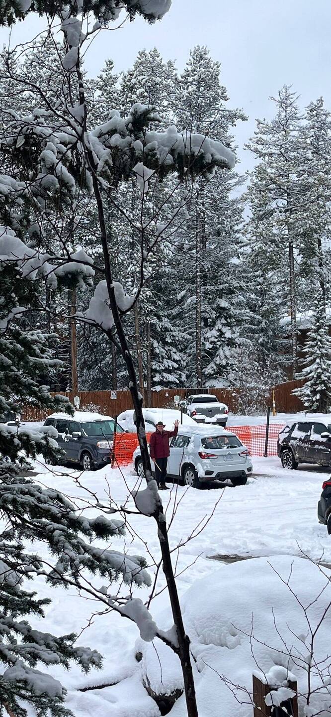Graham clears our car of snow
