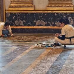 Restoration Workers on Marble Floor