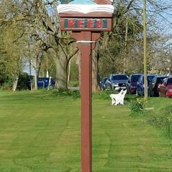 Reed; the village sign at the edge of the green