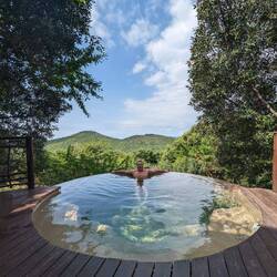 We got upgraded to the lodge from the tent village! Terry loves the coldish plunge pool.