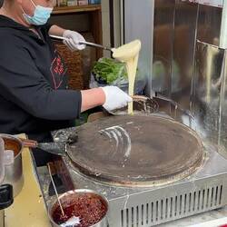 Making our breakfast jianbing pancakes.