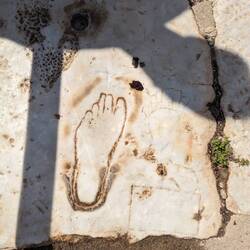 Advertising for a brothel. You had to be old enough that your foot is bigger than the print.