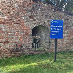 Stop planks stored in a bridge. They're placed across the canal if a section needs to be closed off