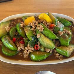 Stir-fried aubergine with pork. See all those little flecks of red? Mouth bombs.