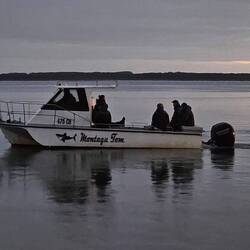 Montague Tom bringing workers back from Robins Island
