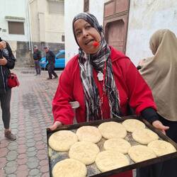 Our guide showing us bread