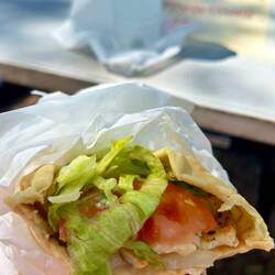 nice place, a few mobile kitchens (little food trucks) and table and chair to spend your time