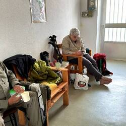 Inside the albergue, trying to thaw our feet