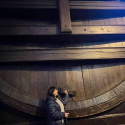 Laura trying to get some wine out of the BIG 275,000 gal barrel..no luck.