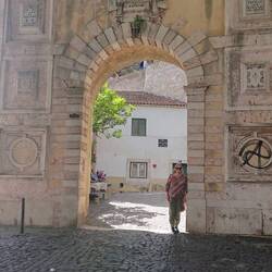 Kate at entrance gate to Sao Jorge Castle