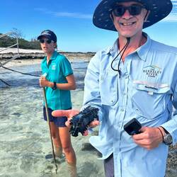 Reef walk, Chris with a sea cucumber