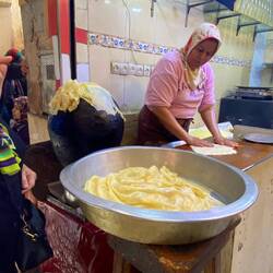 Making traditional Moroccan pancakes, they're cooked on the round ball