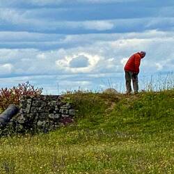 Roel checking his camera on the defensive berm