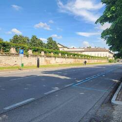 The castle and fence that encloses the garden under renovation