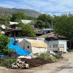 Mountain village with tents and mobile homes