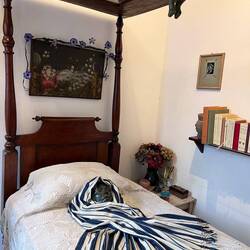 Her bed with the mirror above