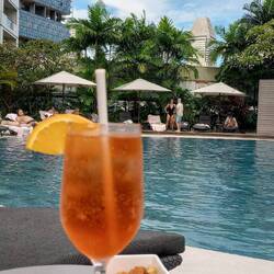 Pool view with an Aperol Spritz - a nod to Italy
