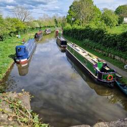 Rainboat and The Black Cat moored together. Will fitted a hook to Rainboat's stern for the life ring