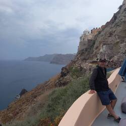 On our terrace at Oia with the fortress behind