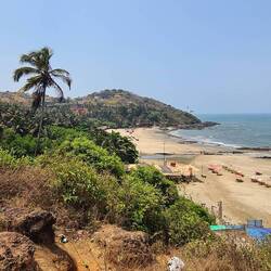 Climbing over the cliffs to our local beach