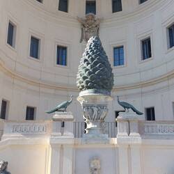 This statue of a pine cone was to represent new growth/fertility